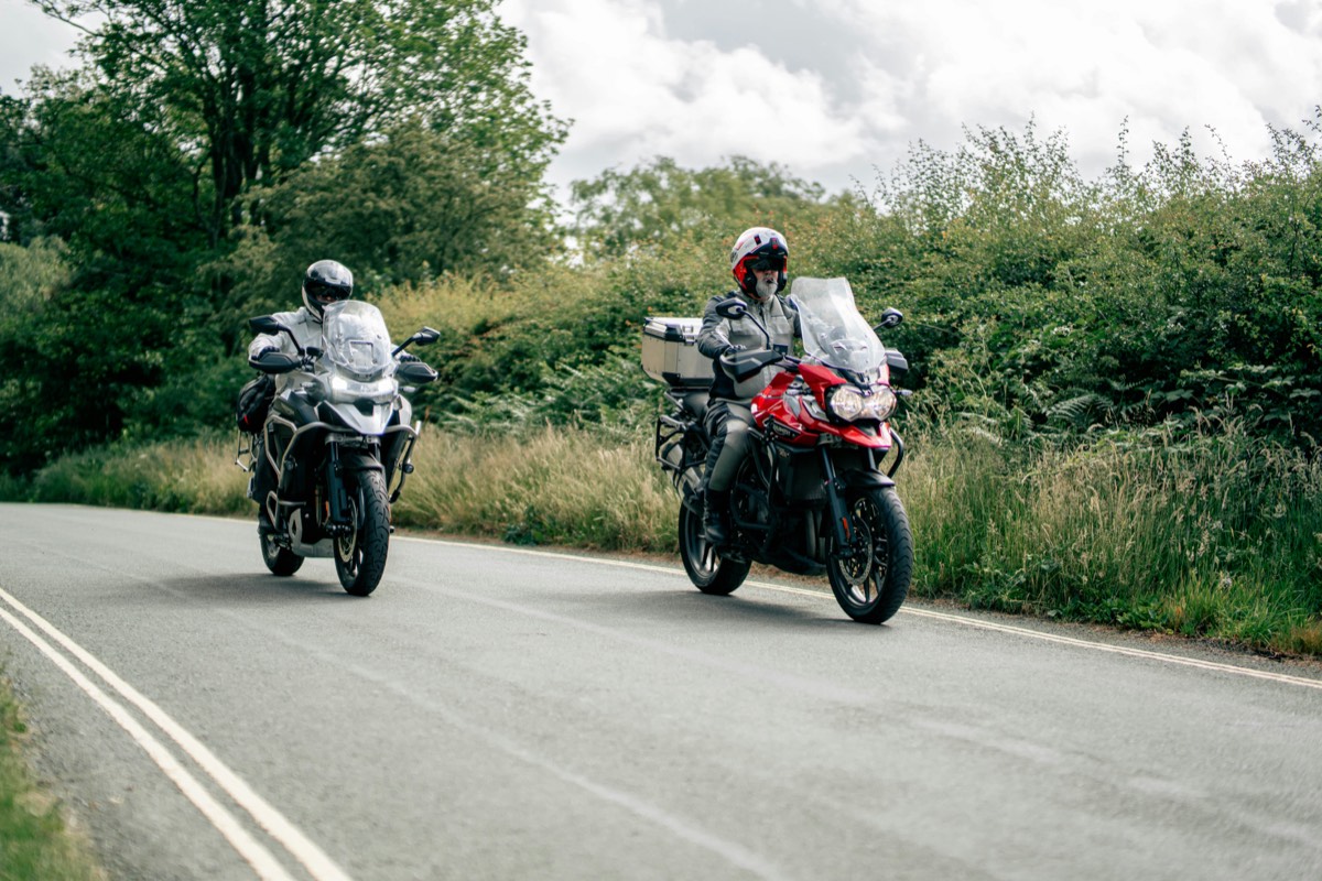 Two riders on a country road